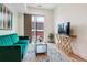 Comfortable living room with stylish decor, natural light, and balcony access at 2876 W 53Rd Ave # 305, Denver, CO 80221