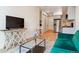 Cozy living room with stylish furnishings, open layout, and hardwood flooring at 2876 W 53Rd Ave # 305, Denver, CO 80221