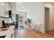 Bright living space with hardwood floors, modern furnishings, and balcony access at 2876 W 53Rd Ave # 305, Denver, CO 80221