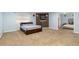 Spacious bedroom showcasing light blue walls, carpet flooring, and a bedroom with a large doorway in the background at 18242 E Bethany Pl, Aurora, CO 80013