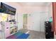 bedroom offers carpet floors, pink walls and a doorway into the adjoining bathroom at 18242 E Bethany Pl, Aurora, CO 80013