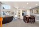 Open dining room with lots of windows and a dining table with seating for six at 18242 E Bethany Pl, Aurora, CO 80013