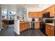 Bright kitchen with stainless steel appliances and wood cabinets at 18242 E Bethany Pl, Aurora, CO 80013