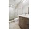 Modern bathroom with a glass-enclosed shower, stylish vanity, and contemporary fixtures at 1386 Zenobia St, Denver, CO 80204