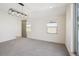 Bedroom with natural light, carpet and a modern light fixture at 1386 Zenobia St, Denver, CO 80204