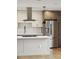 Modern kitchen showcasing stainless steel appliances, a large island, and two-tone cabinetry at 1386 Zenobia St, Denver, CO 80204