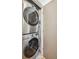 Efficient laundry area with stacked washer and dryer, maximizing space in this modern home at 1386 Zenobia St, Denver, CO 80204