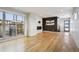 Spacious living area features hardwood floors, a modern fireplace, and sliding glass doors to an outdoor patio at 1386 Zenobia St, Denver, CO 80204