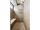 Tile shower with built in bench, modern fixtures and a window at 1386 Zenobia St, Denver, CO 80204