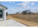 Newly constructed home backyard with fresh landscaping and a wood perimeter fence at 13920 Hanging Lake St, Parker, CO 80138