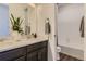 Stylish bathroom featuring double sinks, granite countertops, a decorative plant and a shower and tub combination at 13920 Hanging Lake St, Parker, CO 80138