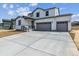 Attractive two-story home with a three-car garage and a large concrete driveway at 13920 Hanging Lake St, Parker, CO 80138