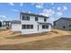 Exterior of a two-story home featuring a concrete patio and newly seeded lawn at 13920 Hanging Lake St, Parker, CO 80138