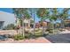 The community area features a serene pond, lush landscaping, and inviting storefronts at 12749 W Glasgow Pl, Littleton, CO 80127