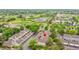 Aerial view of townhomes within community surrounded by lush greenery and mature trees in a desirable neighborhood at 9930 W Progress Pl, Littleton, CO 80123