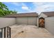 Private backyard patio with wood fence, concrete pad, and access gate, perfect for outdoor living and entertaining at 9930 W Progress Pl, Littleton, CO 80123