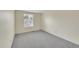 Bedroom featuring carpet and one window with blinds at 9930 W Progress Pl, Littleton, CO 80123