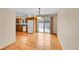 Open dining area featuring hardwood floors and sliding door access to the outside at 9930 W Progress Pl, Littleton, CO 80123