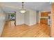 Dining area with chandelier lighting and view into the living room at 9930 W Progress Pl, Littleton, CO 80123