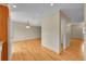 Bright dining area features hardwood floors and opens to another part of the home at 9930 W Progress Pl, Littleton, CO 80123
