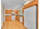 Well-lit kitchen with wooden cabinets, stainless steel appliances, and ample counter space at 9930 W Progress Pl, Littleton, CO 80123