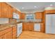 Classic kitchen with wood cabinets, granite counters and stainless-steel appliances at 9930 W Progress Pl, Littleton, CO 80123