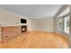 Inviting living room with hardwood floors, brick fireplace, and cozy atmosphere at 9930 W Progress Pl, Littleton, CO 80123