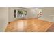 Bright living room featuring hardwood floors, staircase, and large windows at 9930 W Progress Pl, Littleton, CO 80123