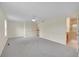 Large main bedroom with carpet floors, closet, and an attached bathroom at 9930 W Progress Pl, Littleton, CO 80123