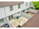 An aerial view of the townhome's cozy patio, featuring sliding glass doors and fenced perimeter at 9930 W Progress Pl, Littleton, CO 80123