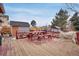 Red wood deck, detached shed, and privacy fence offer outdoor relaxation and storage space at 1301 S Yampa Ct, Aurora, CO 80017