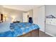 Comfortable bedroom with hardwood floors, a bed with blue Paw Patrol themed covers, and a closet at 1301 S Yampa Ct, Aurora, CO 80017