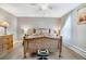 Bedroom with a wooden bed, wood floors, sheer curtains, and simple lamps on nightstands at 1301 S Yampa Ct, Aurora, CO 80017