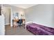 Comfortable bedroom featuring neutral walls, modern flooring, and a functional desk area, creating a versatile and relaxing space at 1301 S Yampa Ct, Aurora, CO 80017