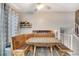 Cozy dining area featuring built-in seating and a view to the upper level at 1301 S Yampa Ct, Aurora, CO 80017