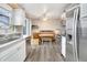 Eat-in kitchen area with stainless steel appliances and custom dining nook at 1301 S Yampa Ct, Aurora, CO 80017