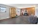 Living room featuring a brick fireplace, hardwood floors, and a bean bag chair at 1301 S Yampa Ct, Aurora, CO 80017