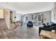 Open-concept living room featuring modern flooring, neutral walls, and stylish decor, creating a versatile and inviting space at 1301 S Yampa Ct, Aurora, CO 80017