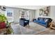 Bright living room featuring neutral walls, plush seating, a decorative rug, and an abundance of natural light at 1301 S Yampa Ct, Aurora, CO 80017