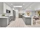 Modern kitchen with gray cabinets, white countertops, and island at 7115 Geneva Ct, Lakewood, CO 80214