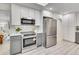 Modern kitchen featuring stainless steel appliances and white cabinets at 7115 Geneva Ct, Lakewood, CO 80214