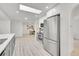 Bright kitchen with stainless steel appliances and gray shaker cabinets at 7115 Geneva Ct, Lakewood, CO 80214