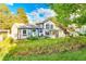 Spacious backyard featuring a well-maintained lawn and covered patio area at 7681 S Jellison St, Littleton, CO 80127