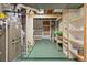 Open basement area with shelving, workshop area, and visible utilities at 7681 S Jellison St, Littleton, CO 80127