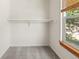 Small closet space with clothing bar and window for natural light at 7681 S Jellison St, Littleton, CO 80127
