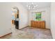 Bright dining area featuring modern light fixture and built in cabinets at 7681 S Jellison St, Littleton, CO 80127