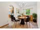 Cozy dining room featuring modern light fixture and decorative rug at 7681 S Jellison St, Littleton, CO 80127