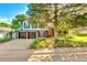 Charming two-story home with a well-manicured lawn and a two car garage showcasing its inviting curb appeal at 7681 S Jellison St, Littleton, CO 80127