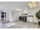 This cozy laundry room includes a sink and modern washer and dryer units at 4840 Depew St, Denver, CO 80212