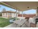 Enjoy the outdoors with covered patio, outdoor seating, and a swing at 4840 Depew St, Denver, CO 80212
